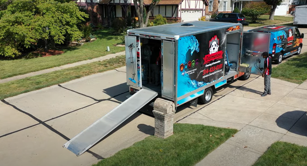 Photo of Dalmation cleaning and restoration of St Louis Missouri. The photo features the Dalmation truck and trailer with cleaning equipment.